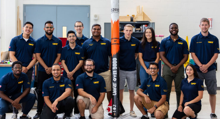 Engineering group with a rocket